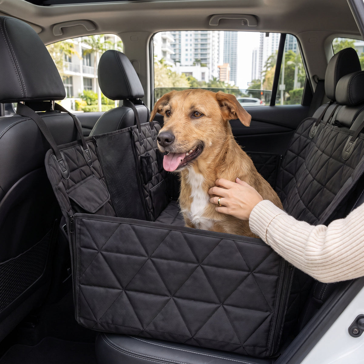 Dog car seat cover installed as a hammock across an SUV back seat with dog inside