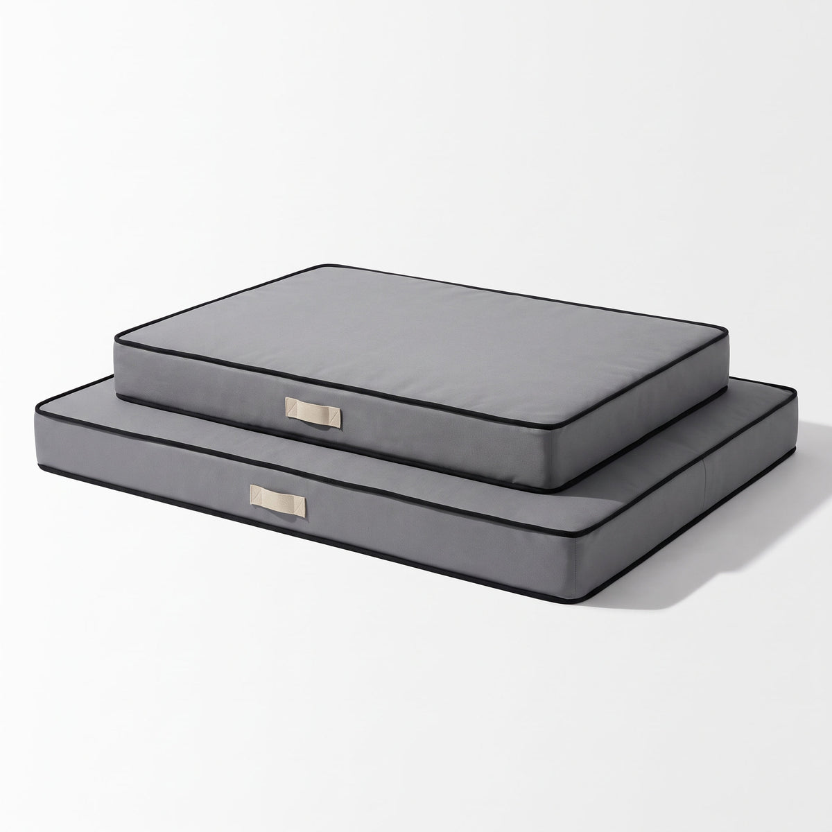 XL and 2XL flat foam dog mattresses stacked to compare size