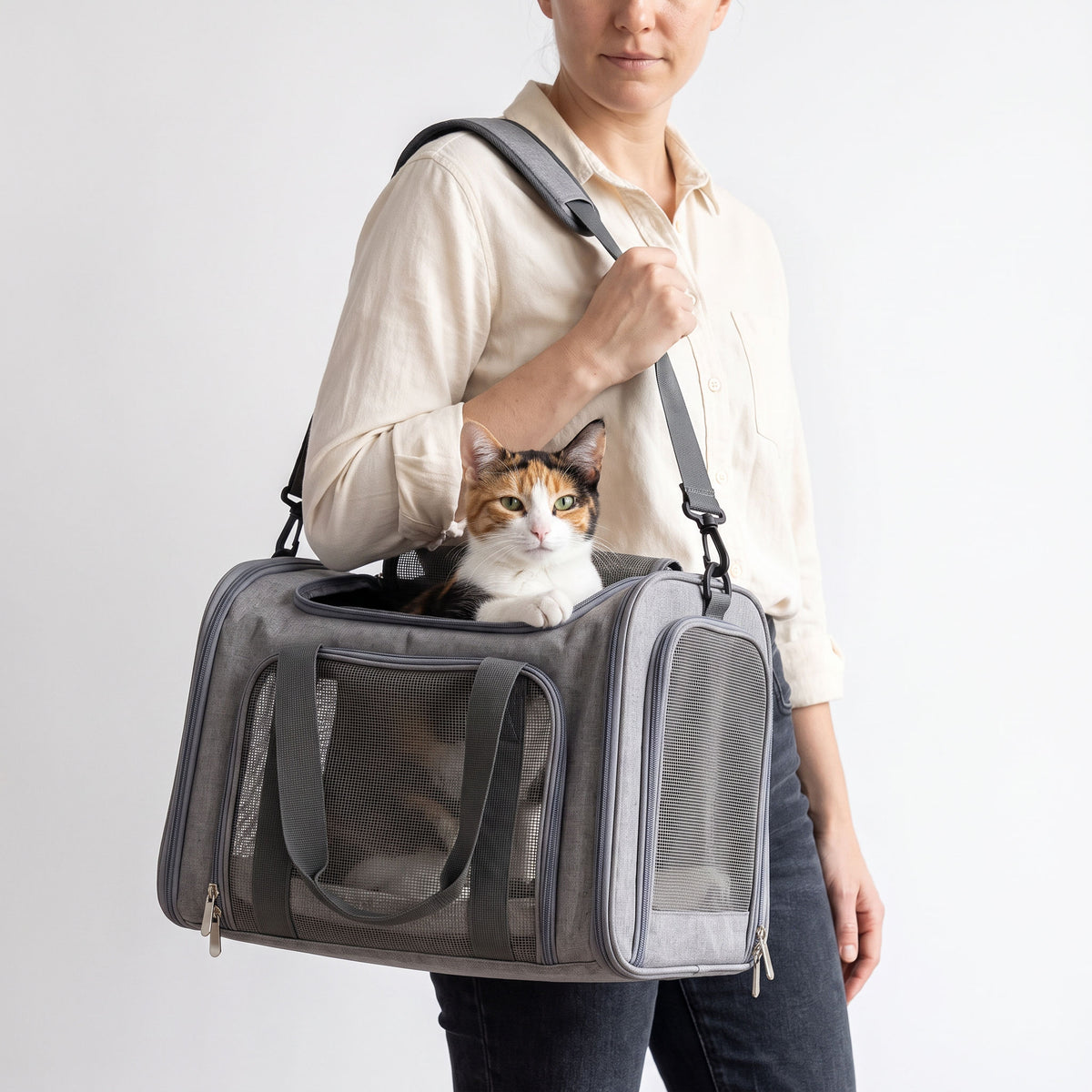 Padded shoulder strap of the pet carrier taking the weight