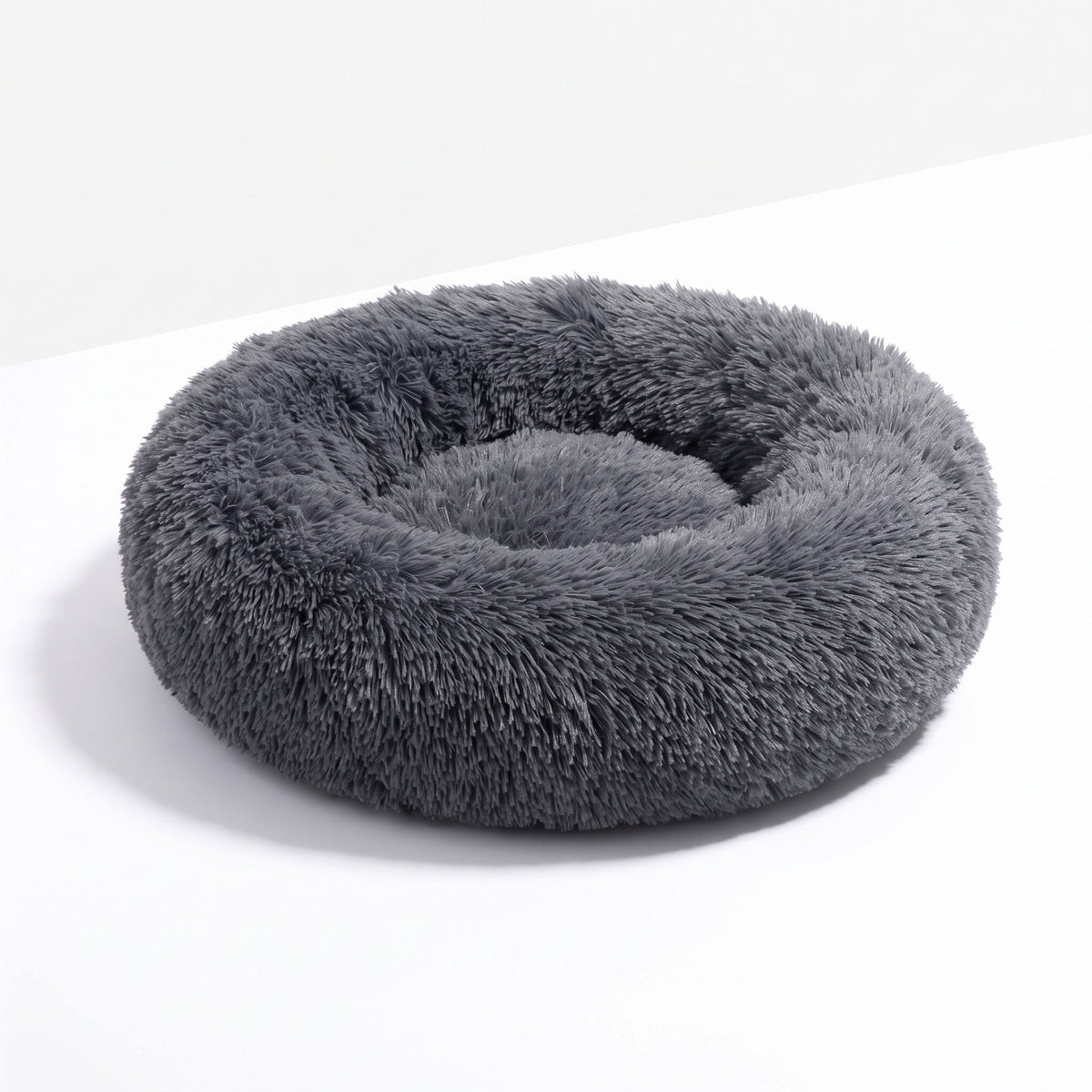 Round plush cat bed with raised edge, product hero